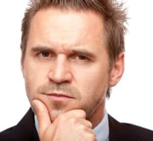 Businessman looks contemplative because of a problem