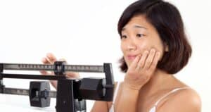 Woman on Weight Scale Dissapointed