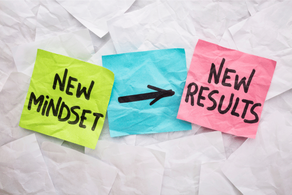 Colorful sticky notes reading 'New Mindset' and 'New Results' with an arrow in between, symbolizing the power of mindset in managing PCOS