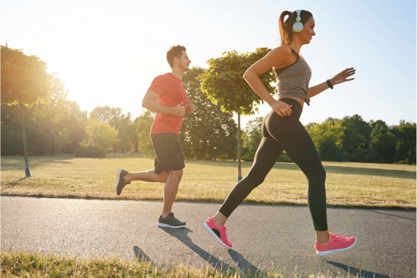 man and woman jogging for heart health