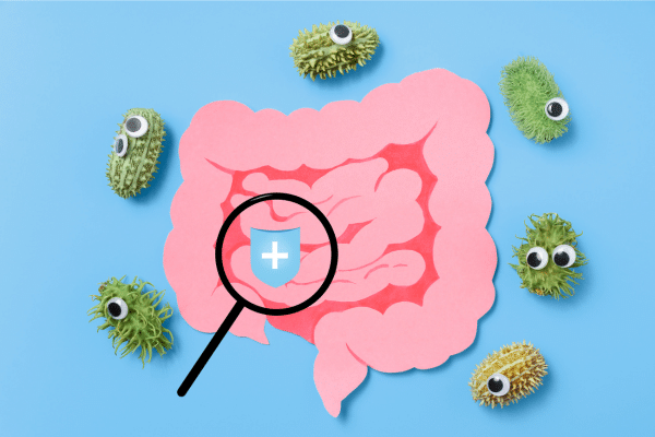 Illustration of gut with friendly microbes representing the gut microbiome