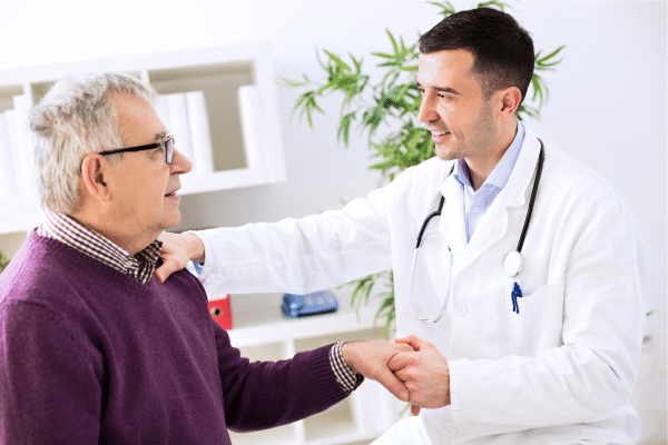 Healthcare provider discussing constipation concerns with an older adult